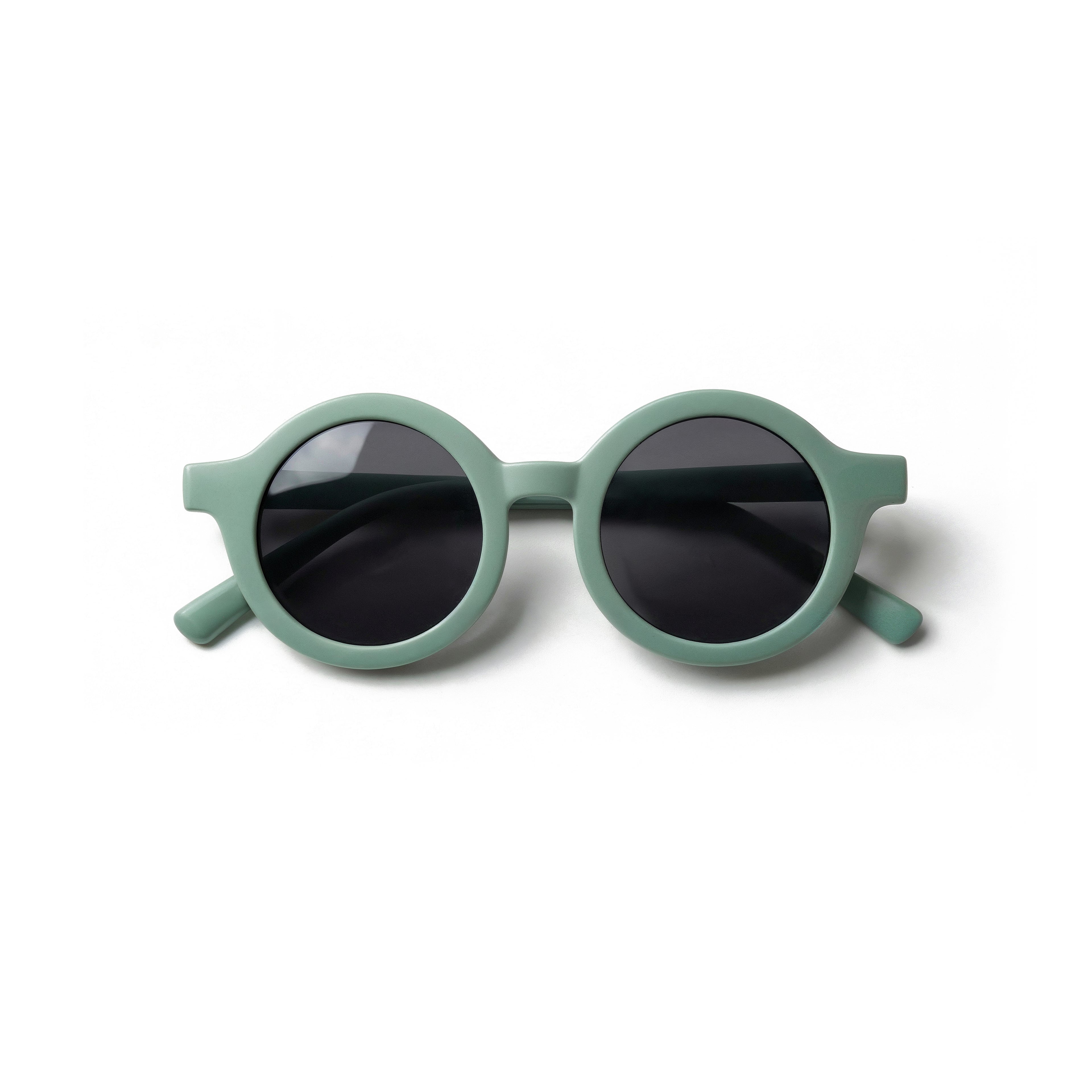 Occhiali da sole zo-oz stile tondo modello Bam verde opaco per bambini 0-2 anni piegati e fotografati dall'alto.